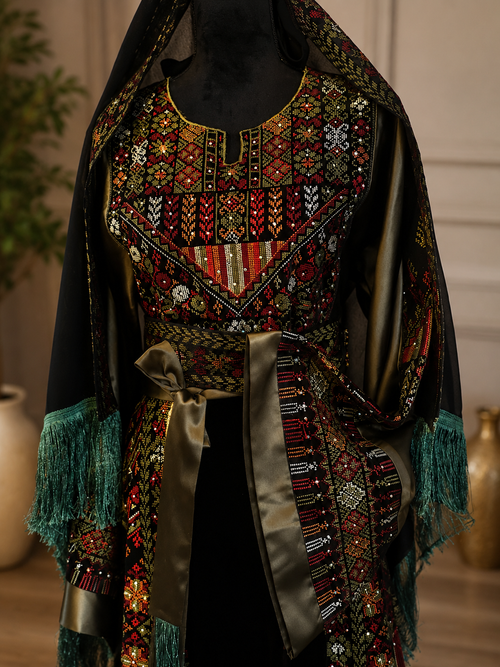 Authentic Palestinian thobe in a beautiful shimmering green color with elegant traditional embroidery and cool velvet fabric. Worn once only, in perfect condition with no flaws.

* Size: 3
* Original price: $250