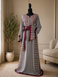 Elegant gray embroidered dress with burgundy satin details.  
Worn only once and in excellent condition — no flaws or defects.  

Original price: $180  
Size: 3