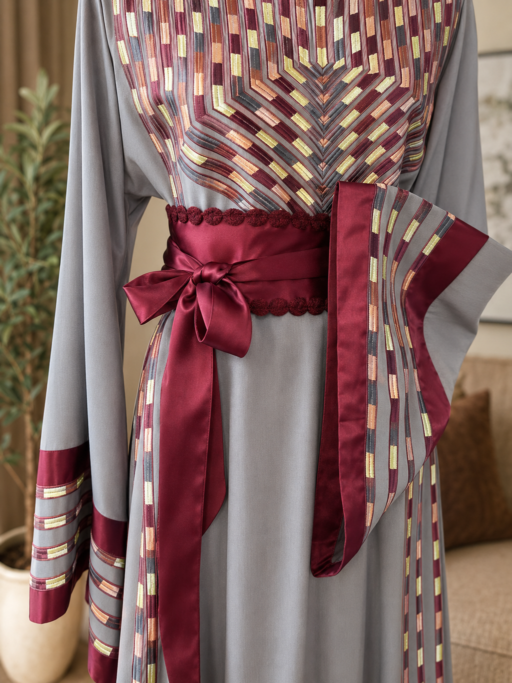 Elegant gray embroidered dress with burgundy satin details.  
Worn only once and in excellent condition — no flaws or defects.  

Original price: $180  
Size: 3