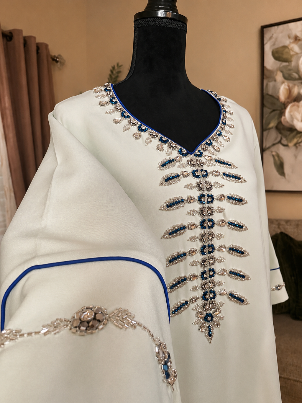NEW! Light blue kaftan with elegant silver and blue hand-beaded details. ✨